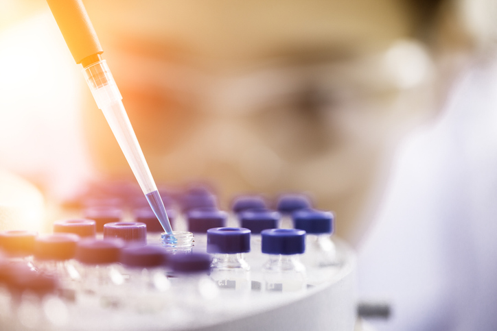 Pipette and vials in a laboratory